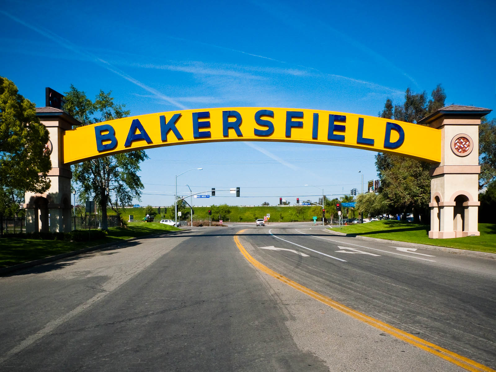 The Bakersfield arch sign lit up at dusk